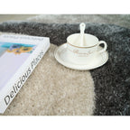 Tapis à poils longs Mateos au design abstrait