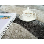 Tapis à poils longs Mateos au design abstrait